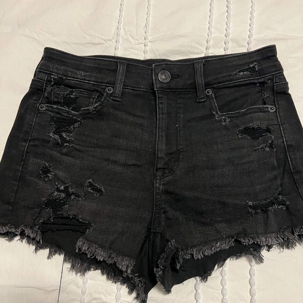 Black frayed jean shorts, size 4. Lightly worn.